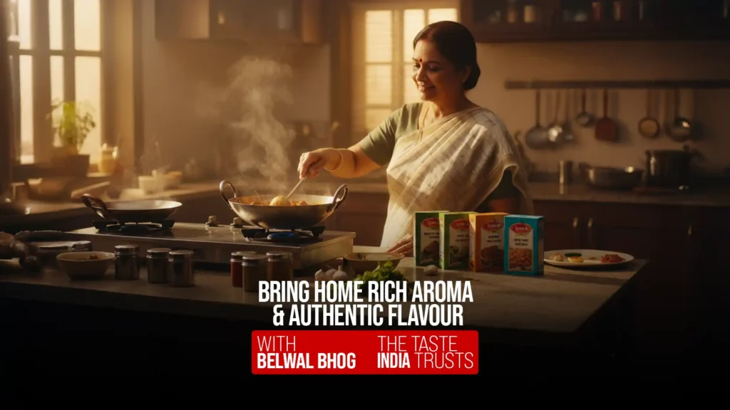 Woman cooking in a traditional Indian kitchen with Belwal Bhog spice packs, the best masala brand in India