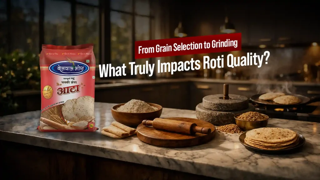 Pack of wheat flour with chakki, fresh rotis, rolling pin, and wheat grains on a kitchen counter representing the best atta brand in Uttarakhand